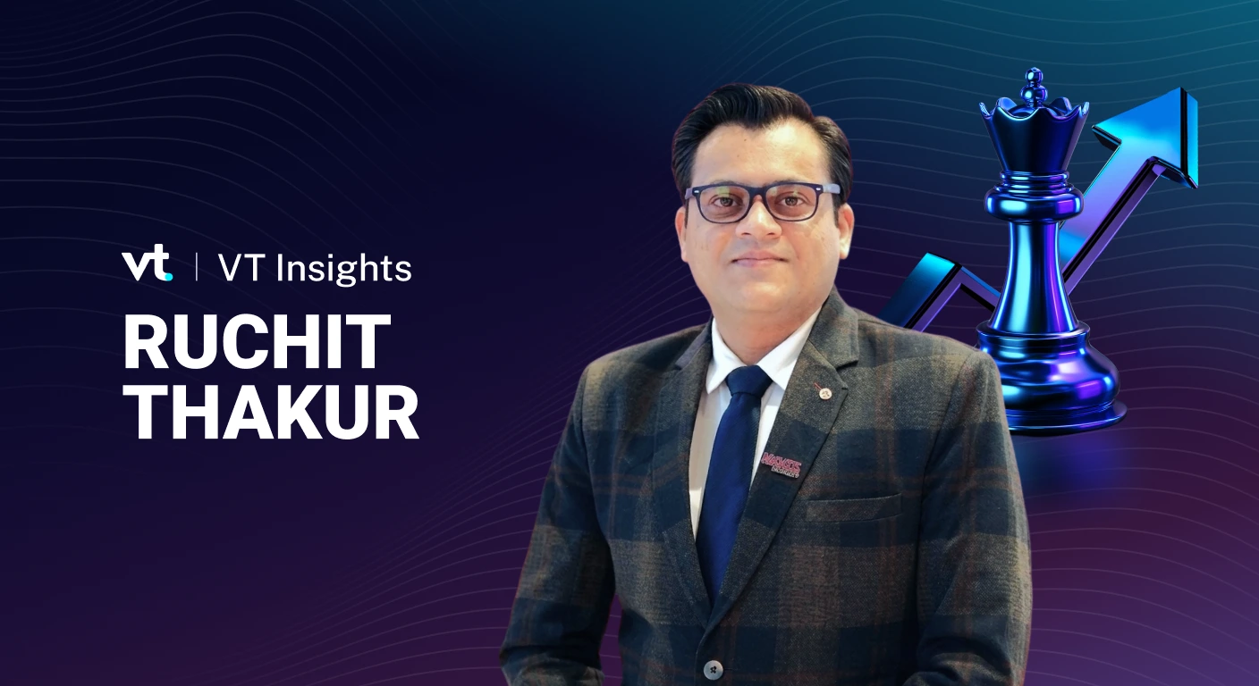 Portrait of Ruchit Thakur in a suit, with VT Insights branding and a blue chess piece backdrop and rising arrow.